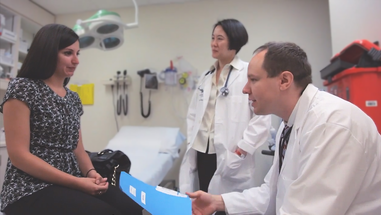 Dr. Siu and Dr. Bedard meet with a patient to discuss the studies she is eligible for